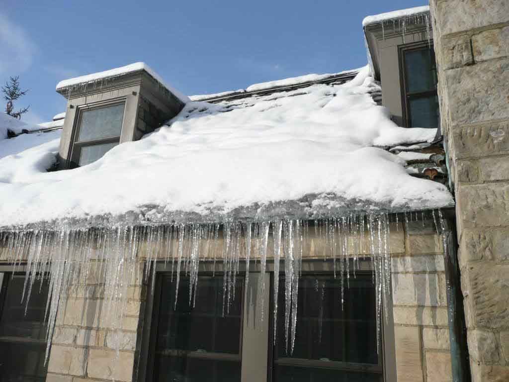 Ice dam removal from a roof edge