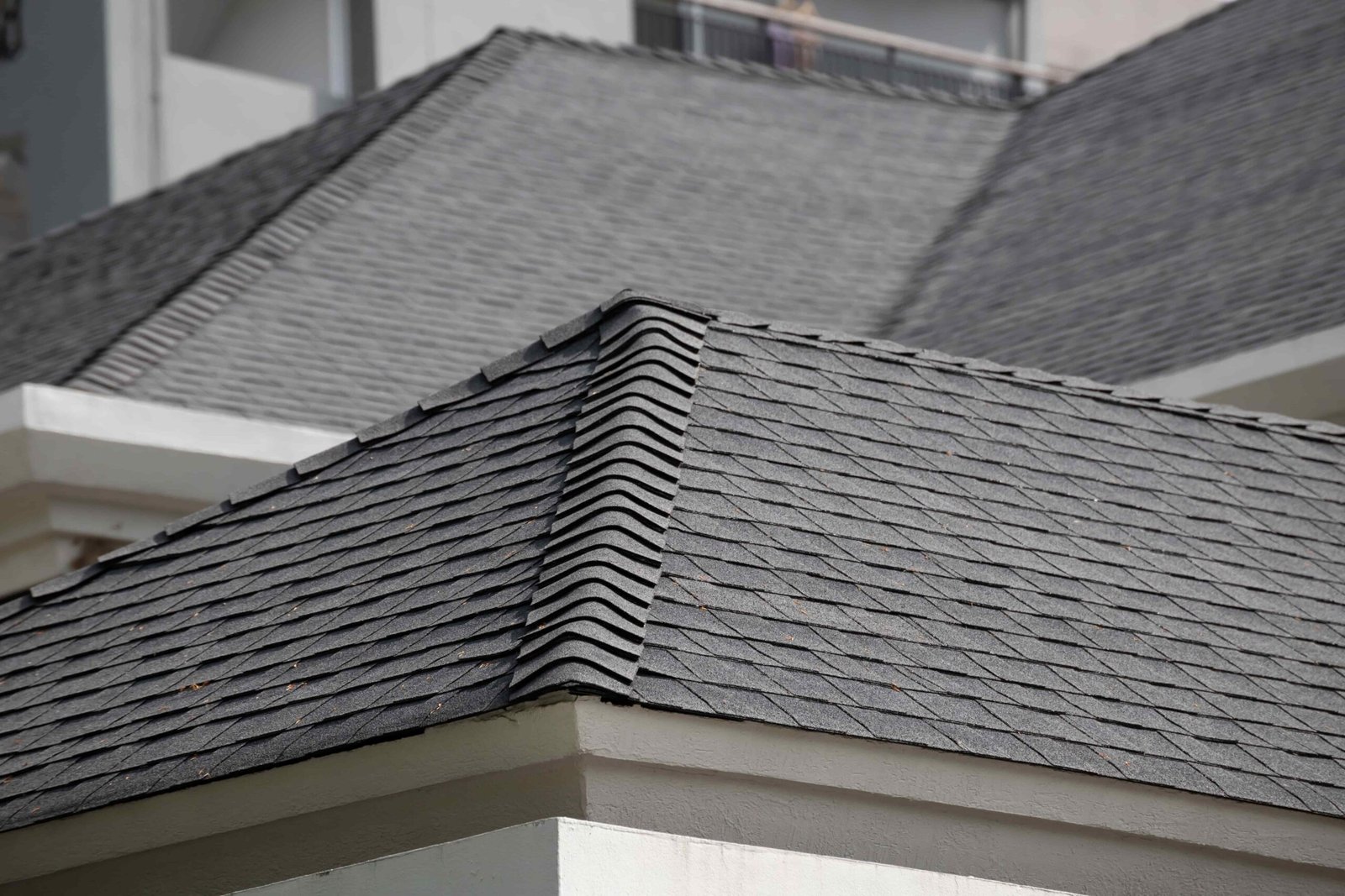Quality Roofing service roof shingle background and texture. dark asphalt tiles on the roof.